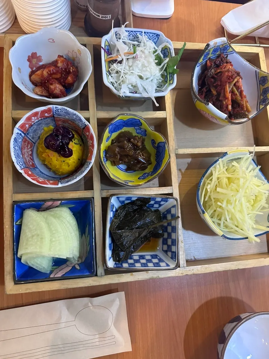 Neatly arranged side dishes at a reserved table