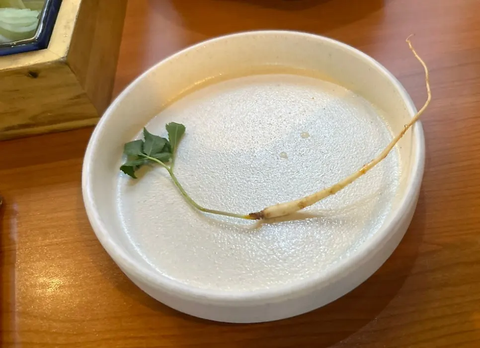 Wild ginseng served alongside grilled eel