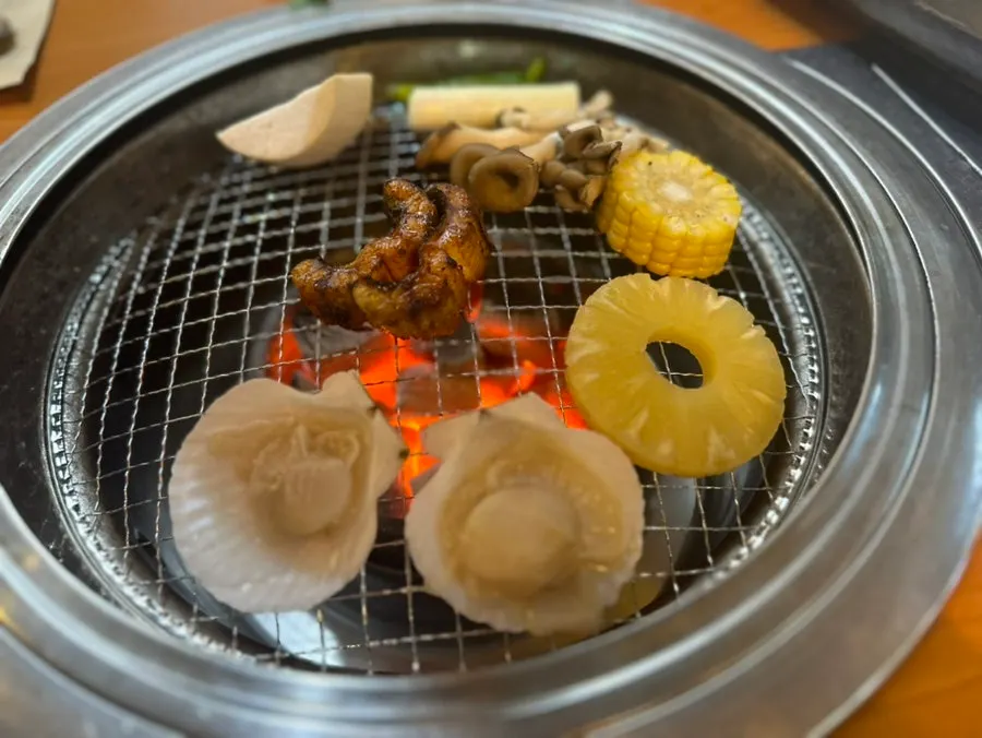 Par-grilled eel warmed on the grill