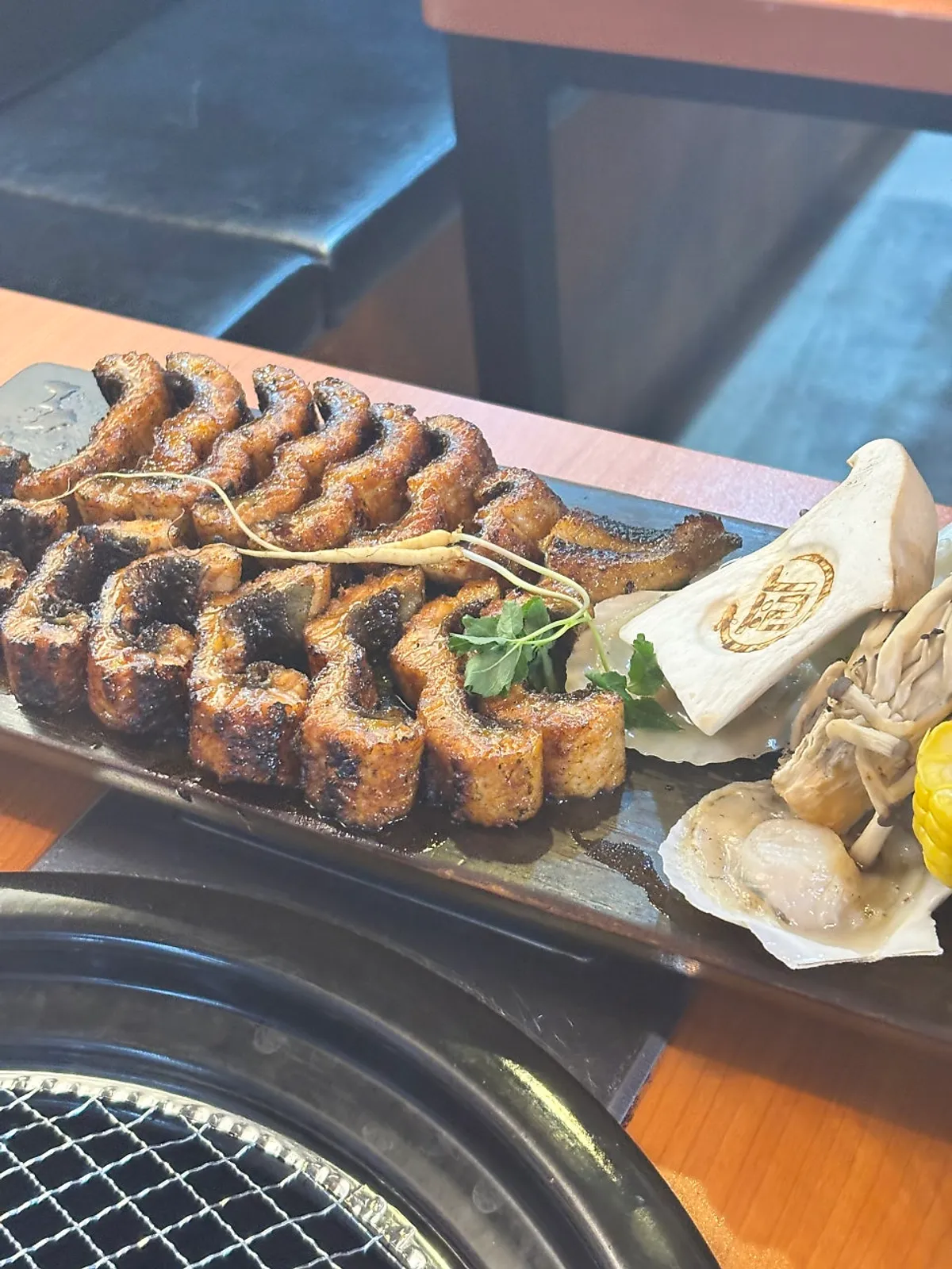 A plate of pre-grilled soy-sauce eel