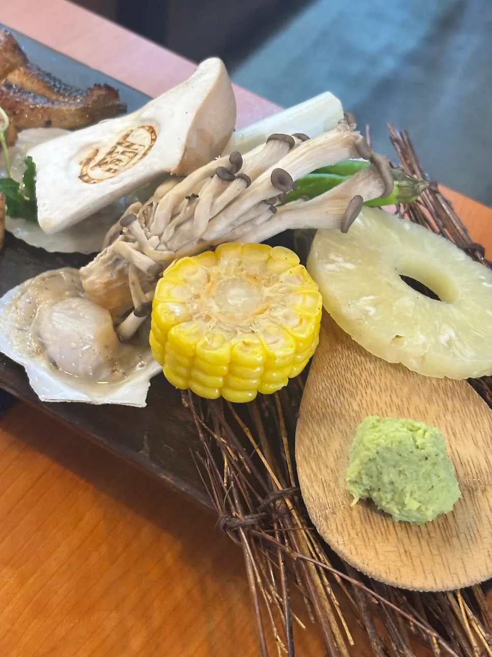 Plate of side vegetables — mushrooms, pineapple, and corn