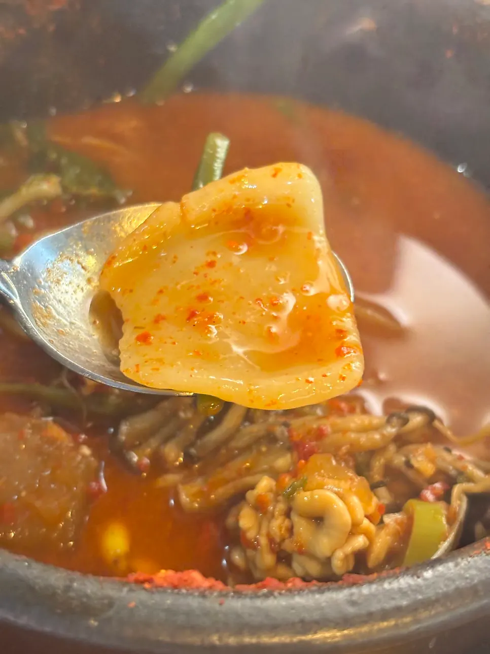 Leftover pot of spicy fish stew after the meal
