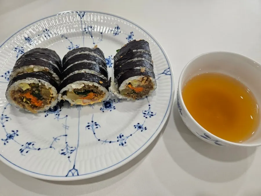 Gimbap and miso soup plated in bowls