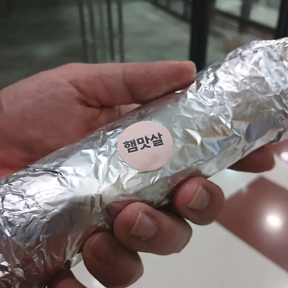 Three heavily packed rolls of gimbap