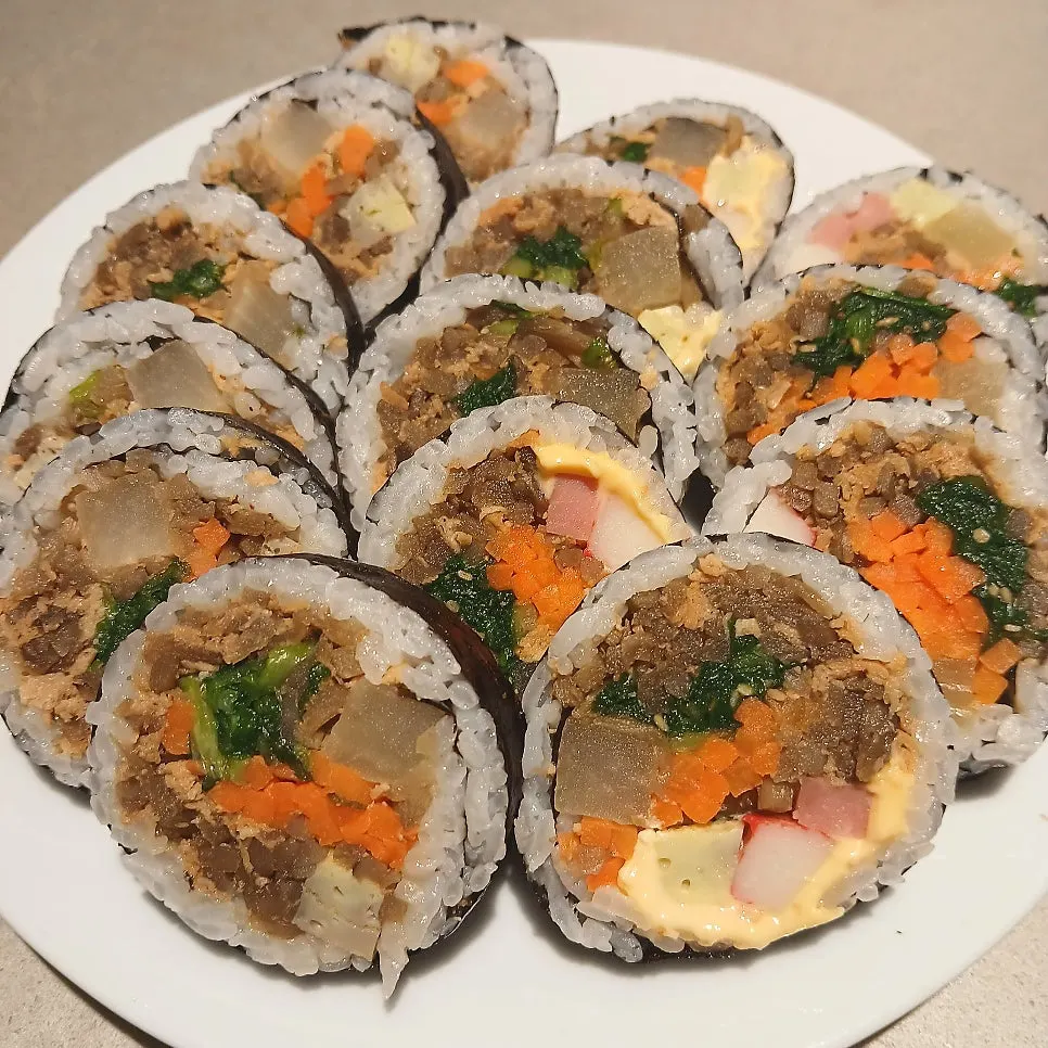 Three types of yubu gimbap arranged on a plate
