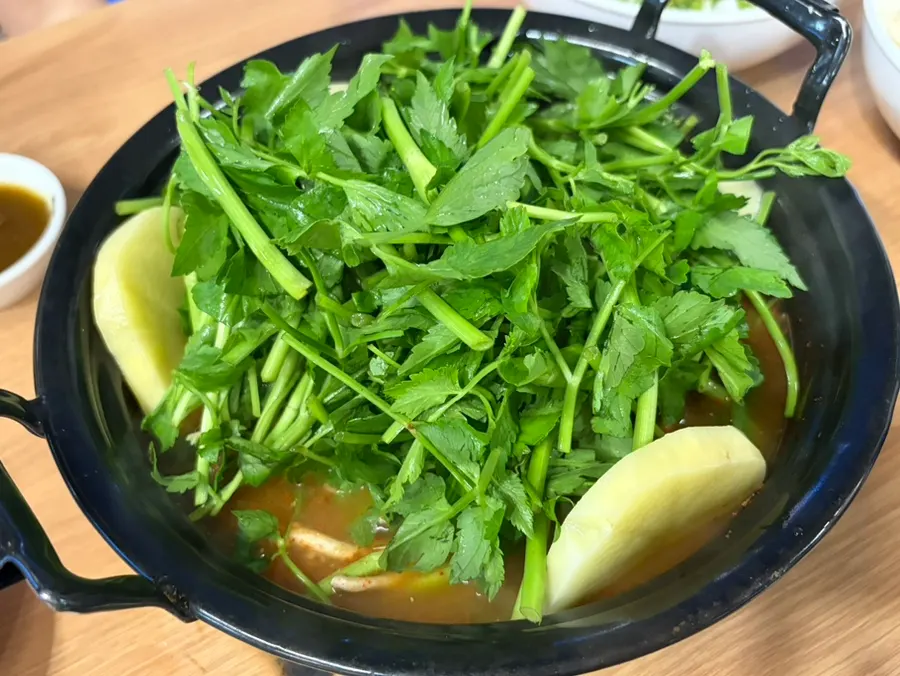 Spicy shabu pot with minari piled up like a mountain
