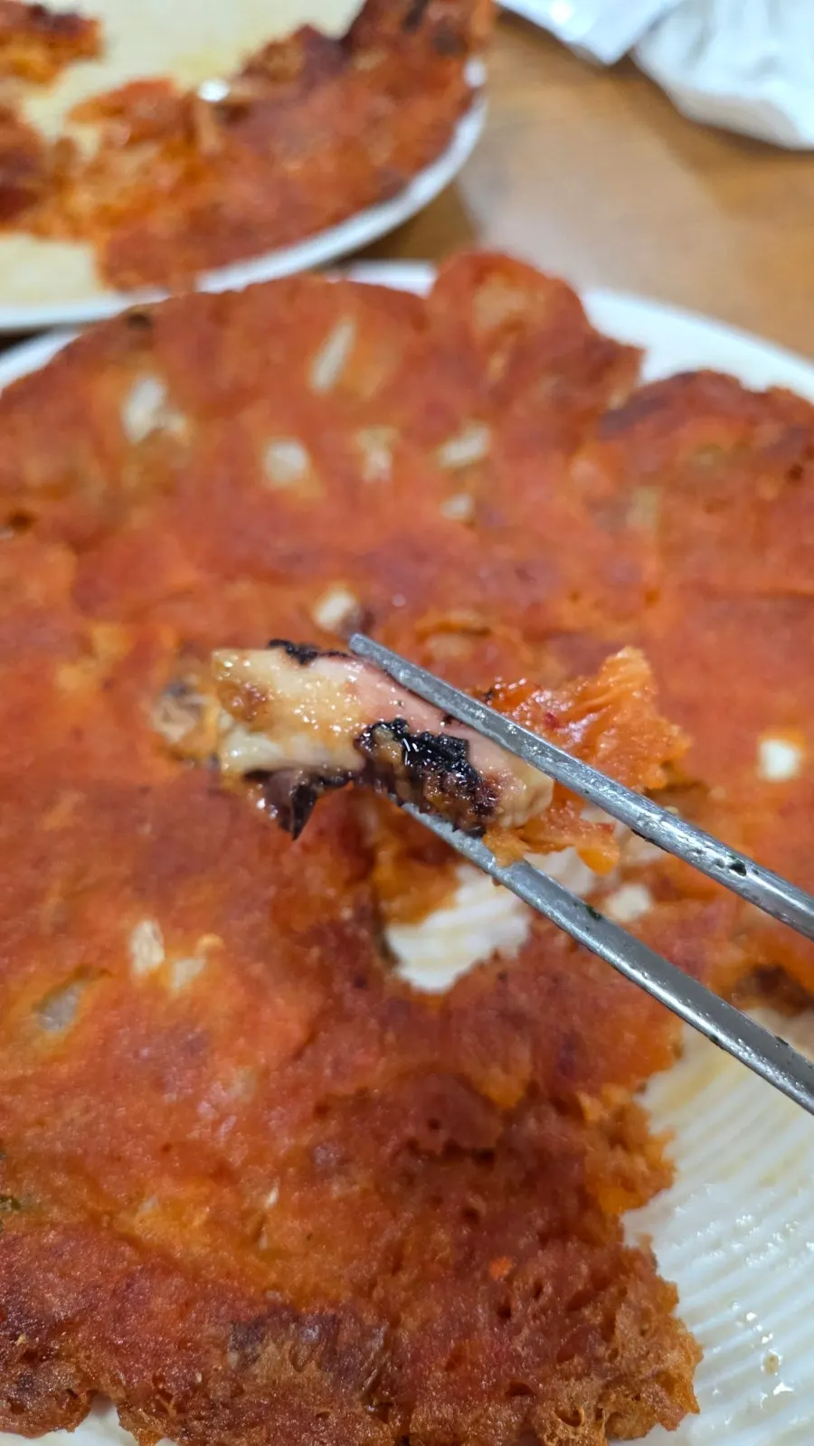 Cross-section of the kimchi pancake, crispy outside and moist inside