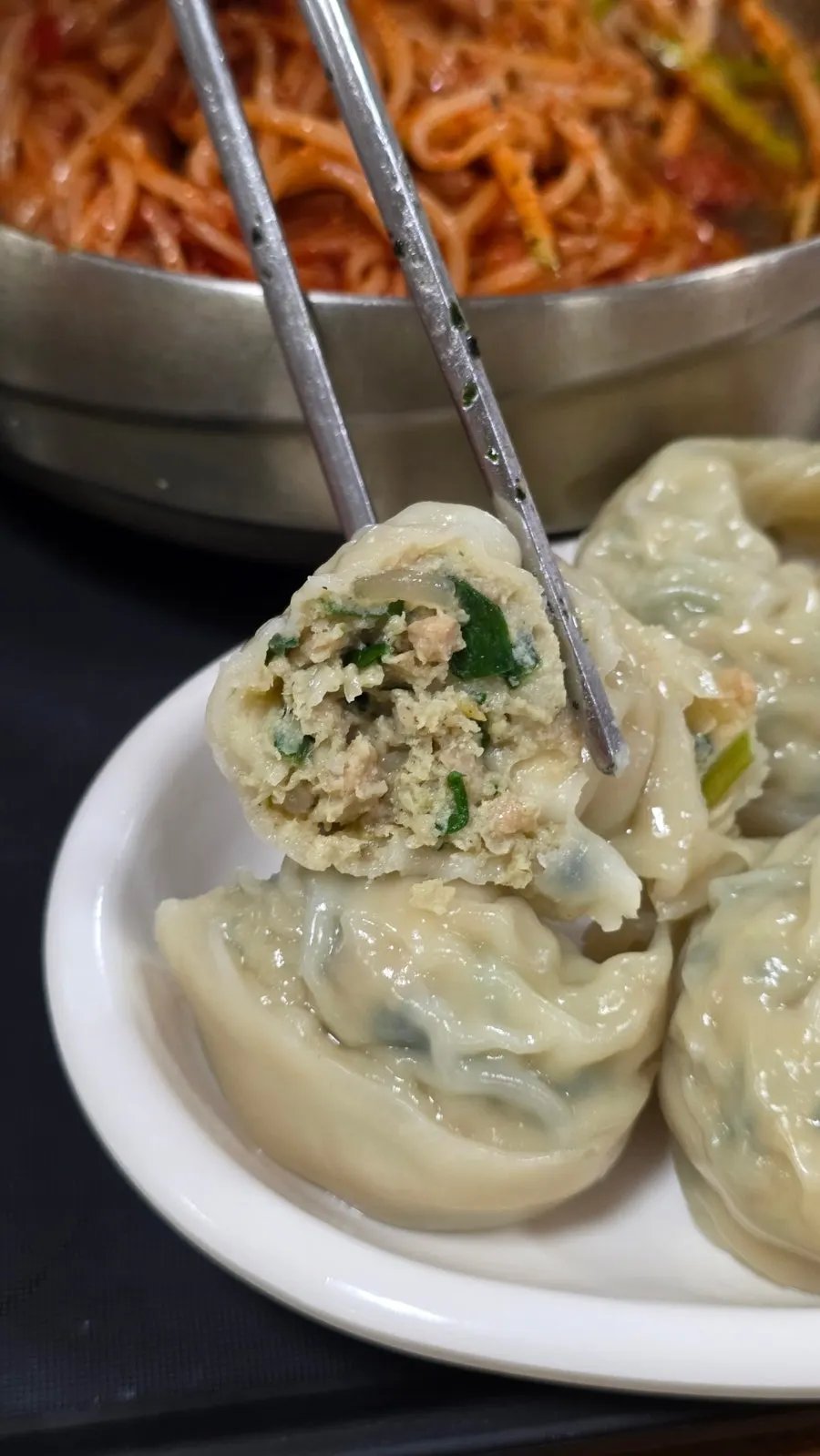 Cross-section of a dumpling filled with meat and chives