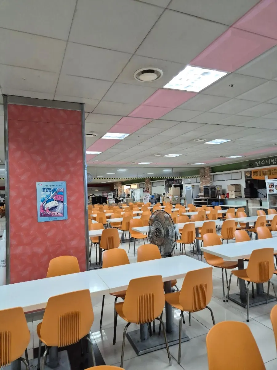 Spacious food court seating with Sangam Hoegwan's stall