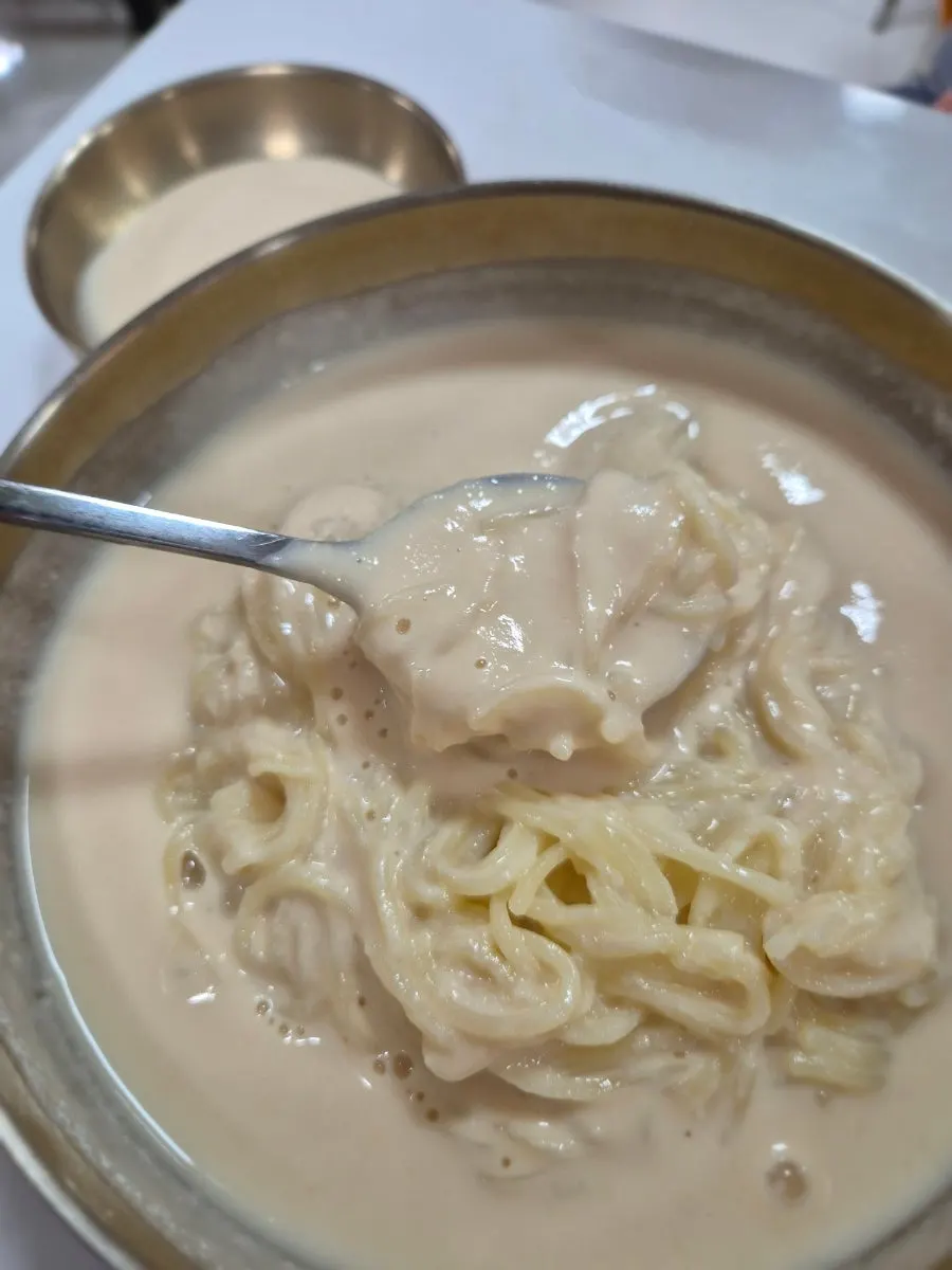 Close-up of the thick soy milk broth and noodles