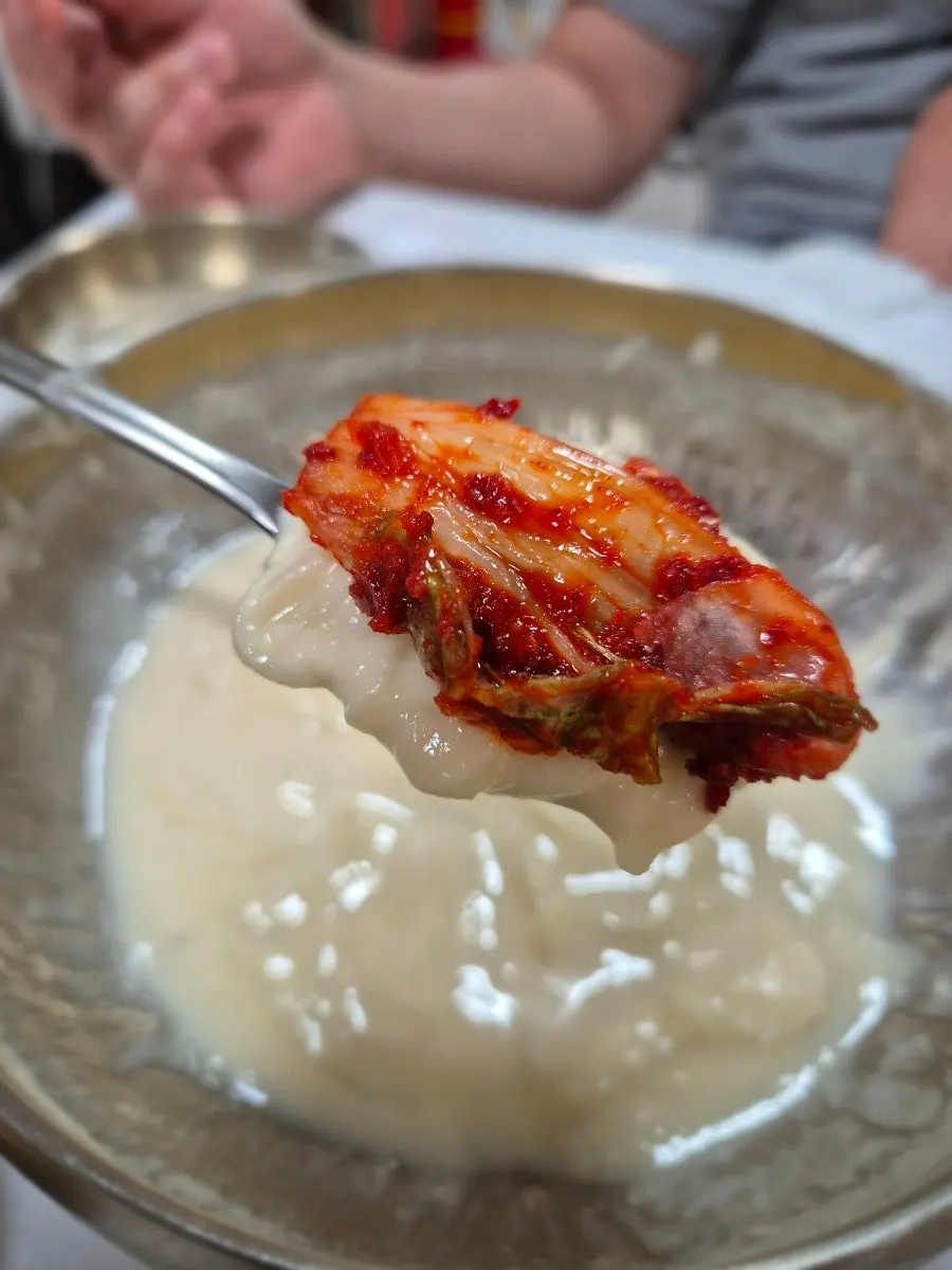 A kongguksu bowl emptied down to the broth