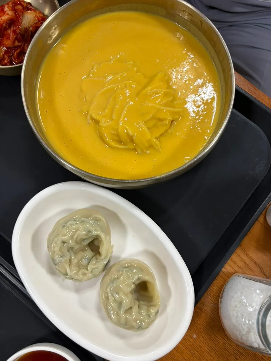 A full spread of the pumpkin kongguksu dumpling set