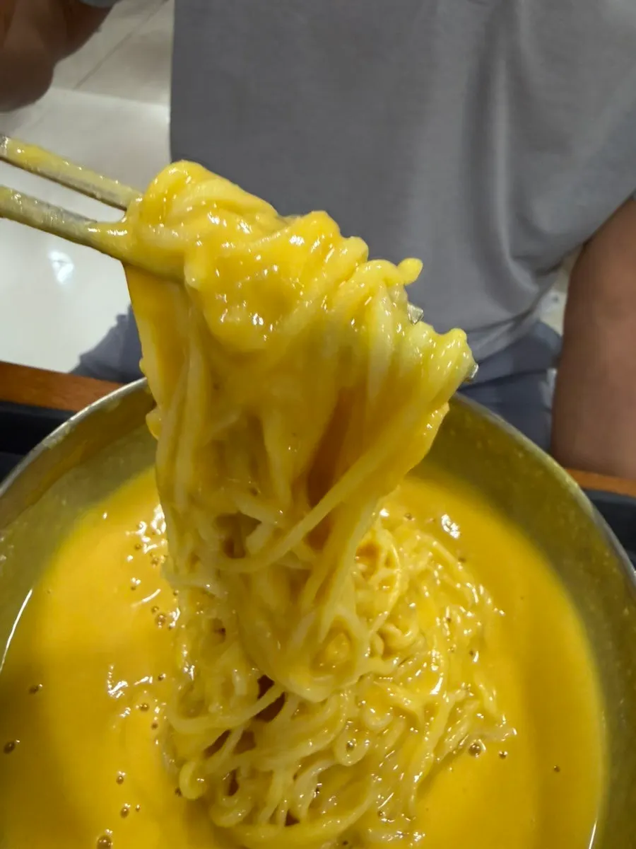 Pumpkin kongguksu noodles coated in soy milk