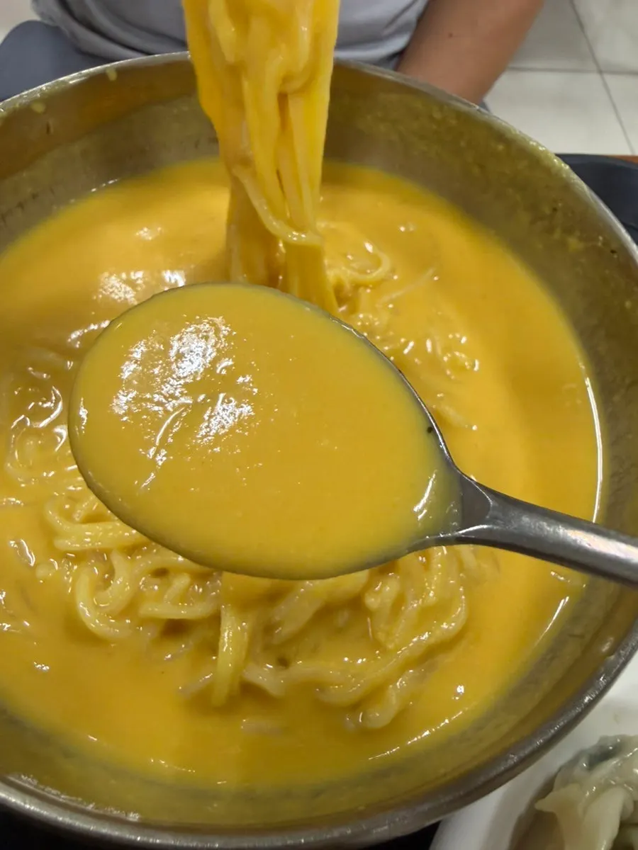 Slurping the pumpkin kongguksu noodles