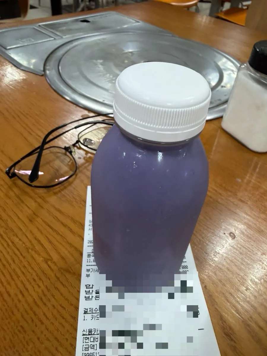 Chilled soy milk stored in the fridge with a glass