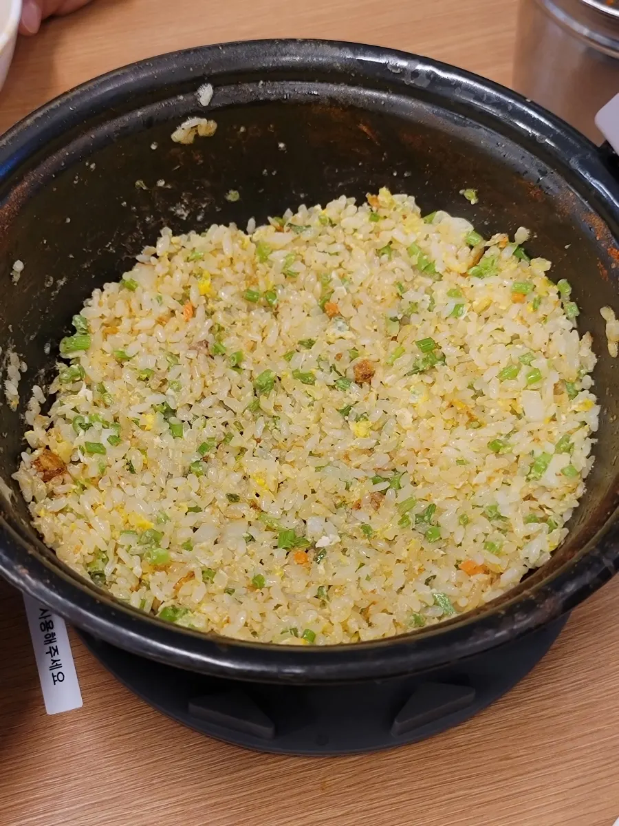 Fried rice brought over after being cooked by staff