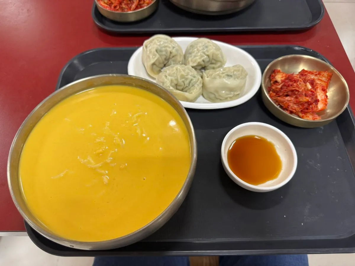 A bowl of nutty pumpkin soy milk noodles