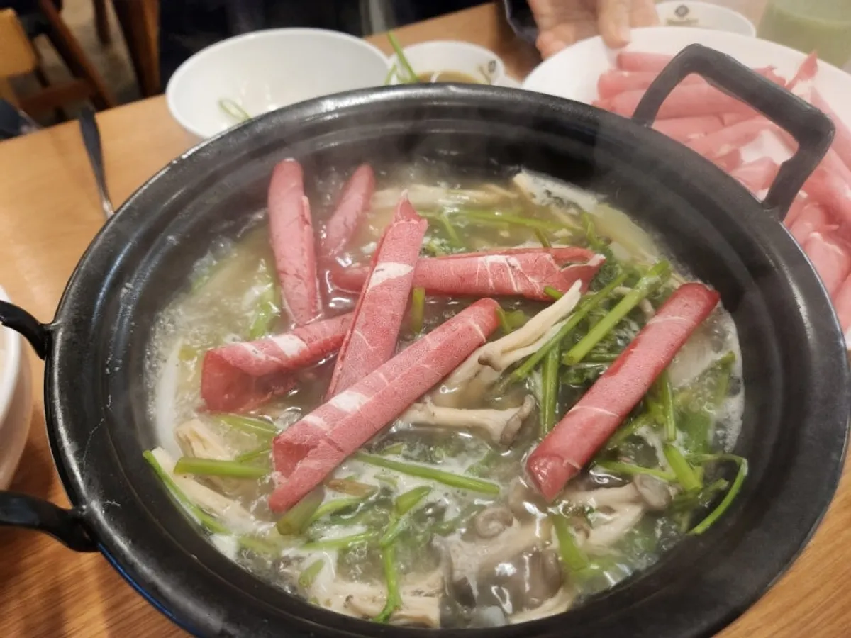 A full table setting of shabu kalguksu at Deungchon Shabu Kalguksu Sangam Branch