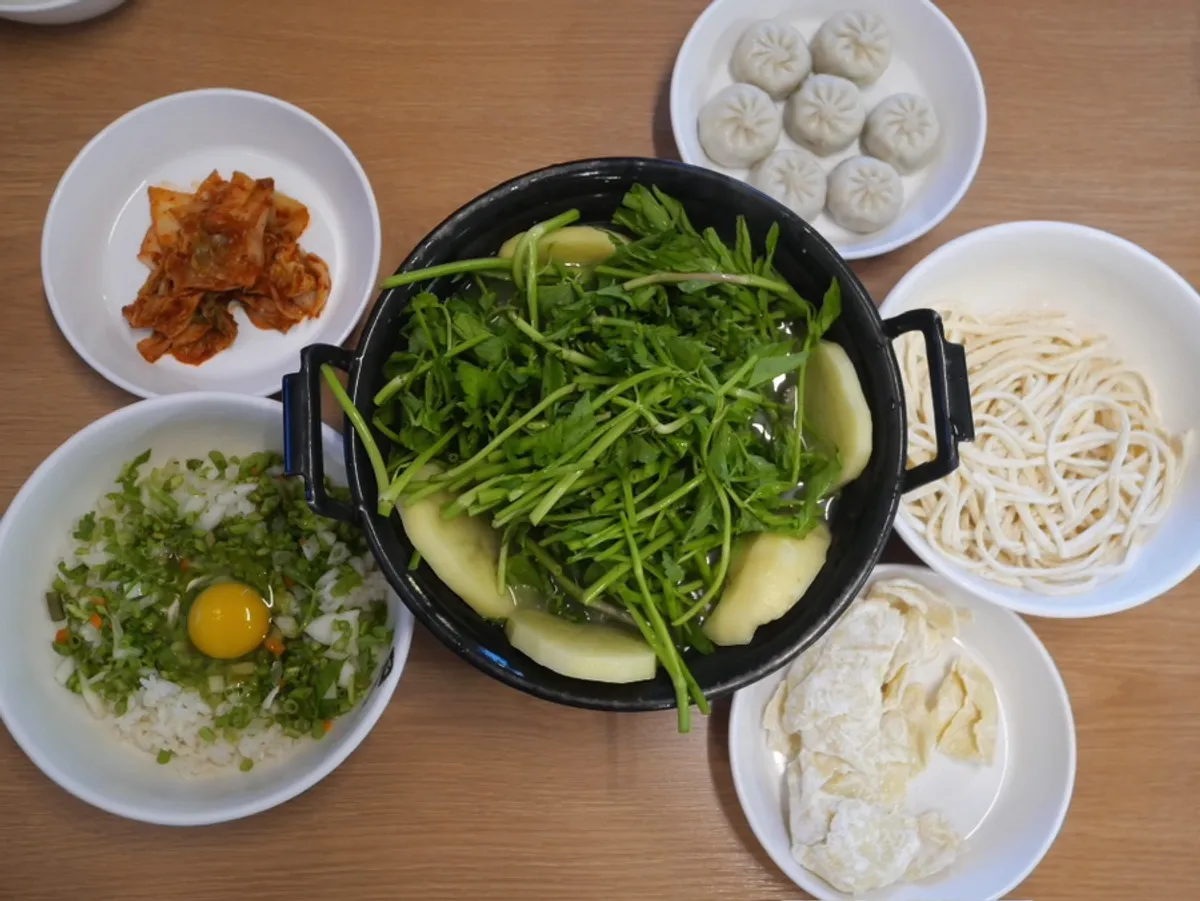 Table setting of perilla mushroom shabu-shabu kalguksu at Deungchon Shabu Kalguksu Sangam Branch