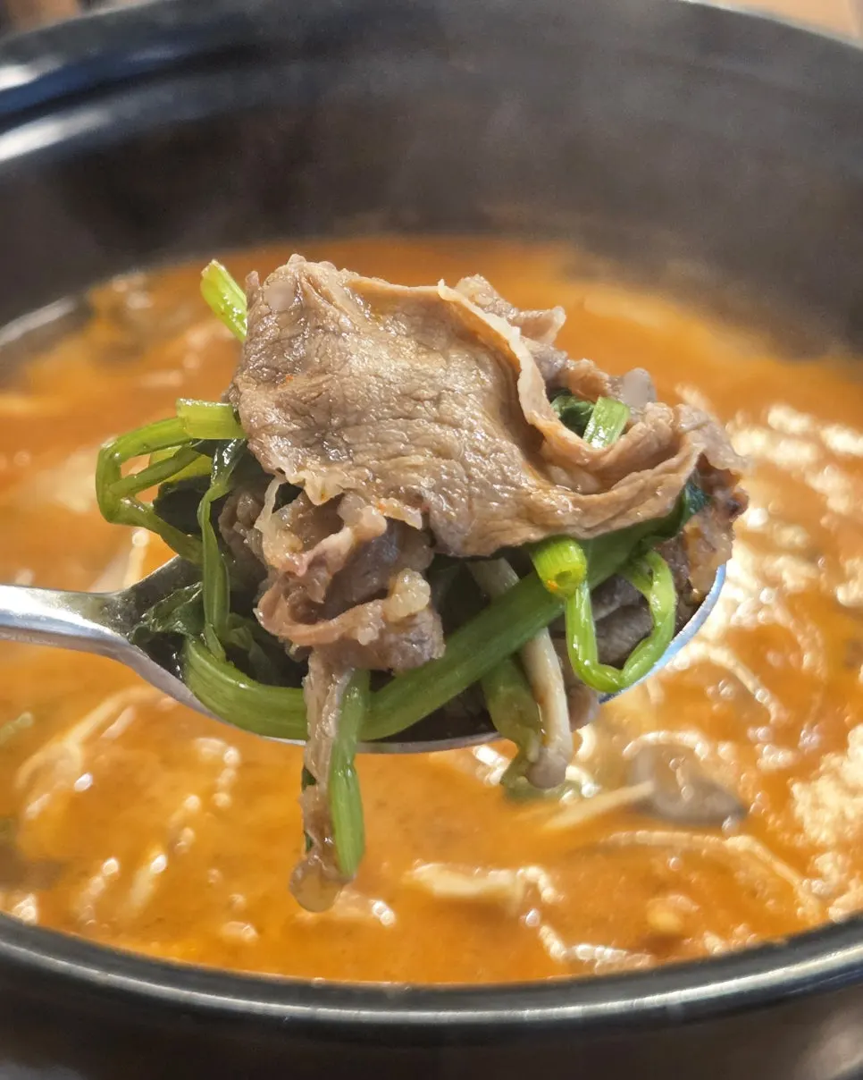 Table spread with the spicy Sangam shabu kalguksu broth