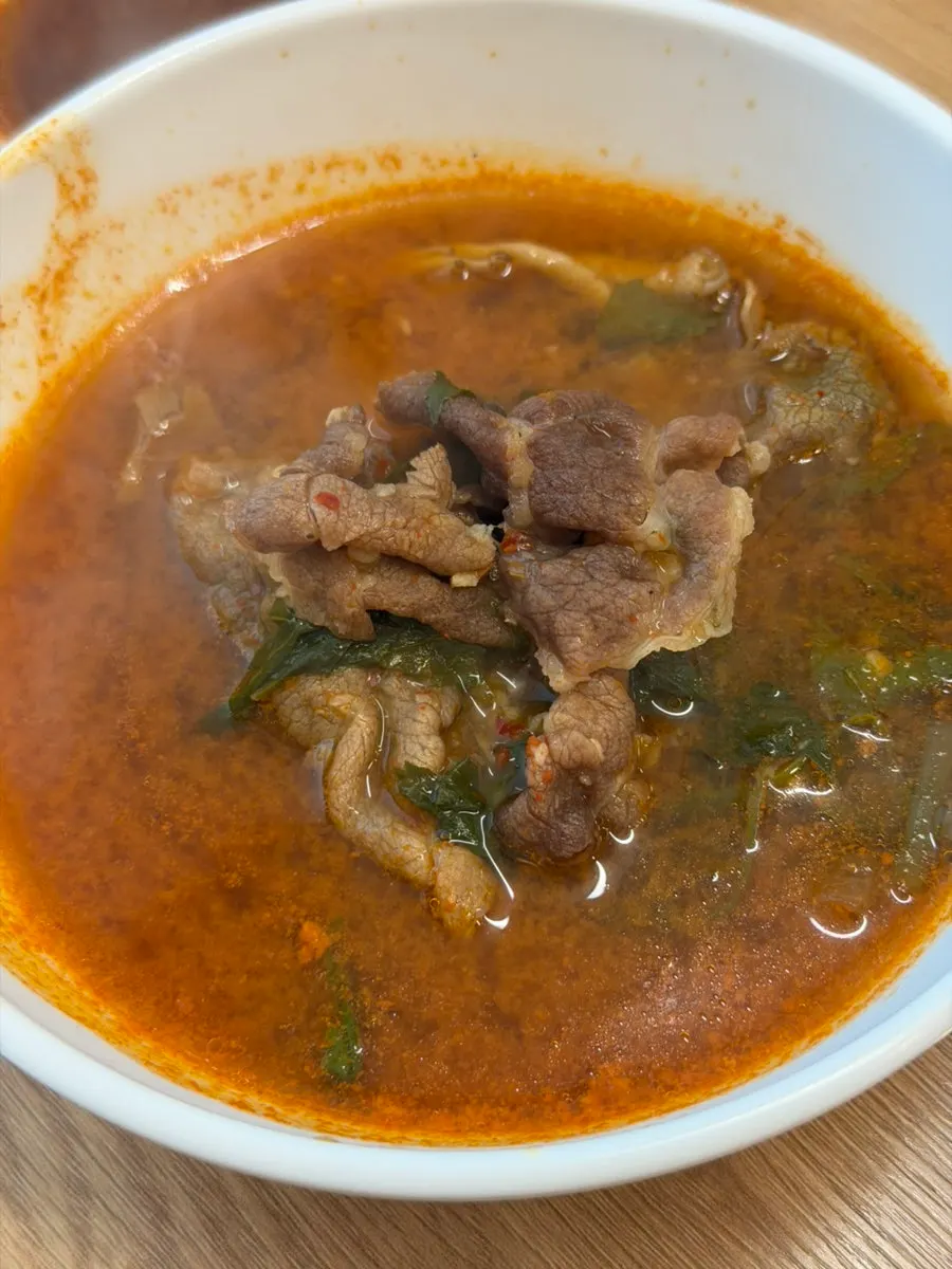 Cooked vegetables and meat in the spicy broth