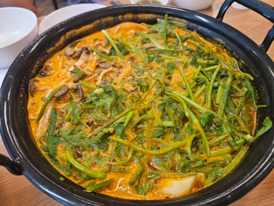 Bubbling spicy kalguksu broth
