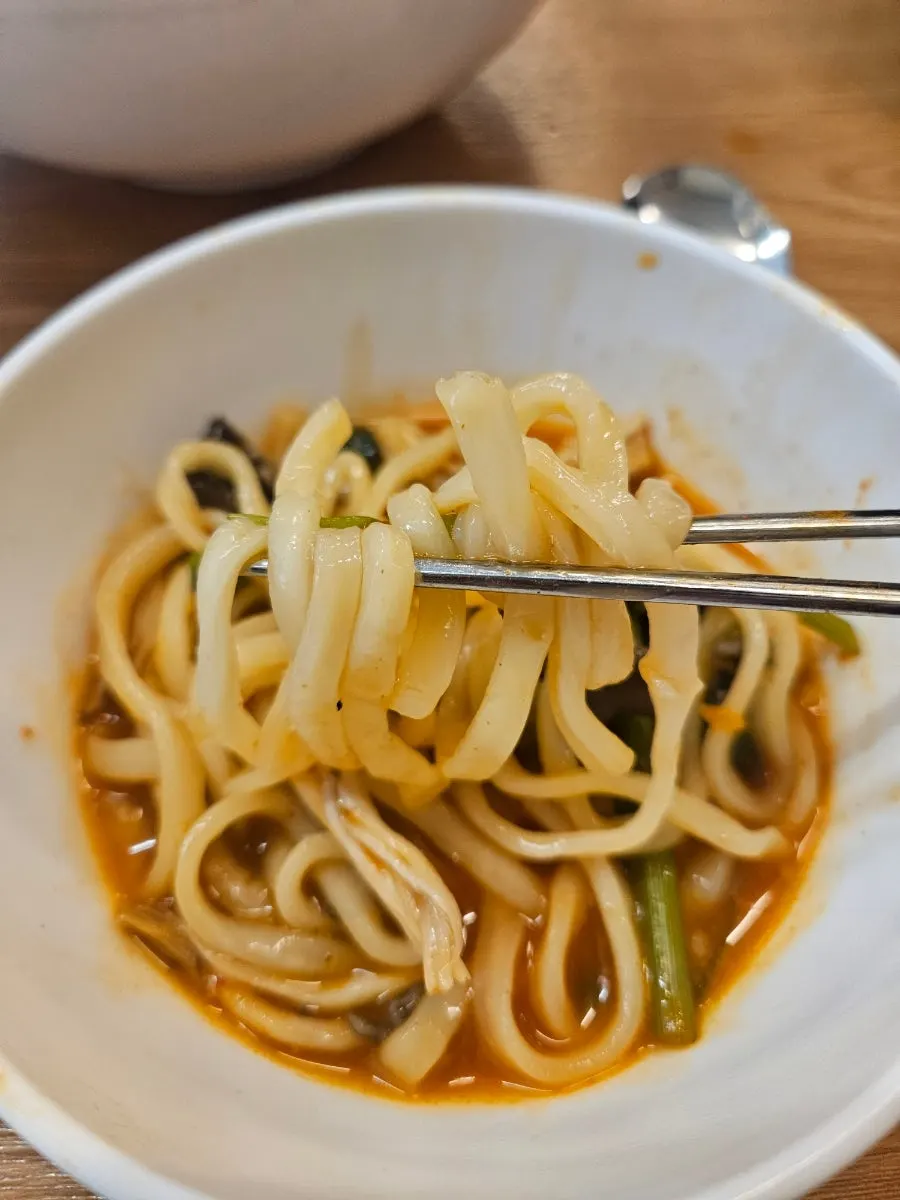 Kalguksu noodles cooked in spicy broth