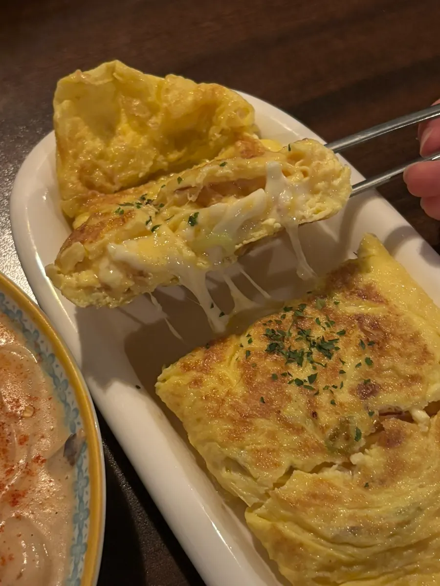 Thick ugly cheese egg roll served with ketchup