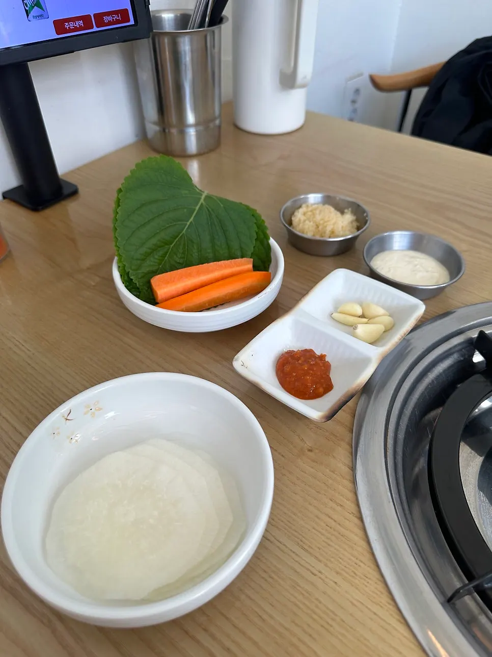 Assorted sides of boiled egg, glass noodles, and fried dumpling