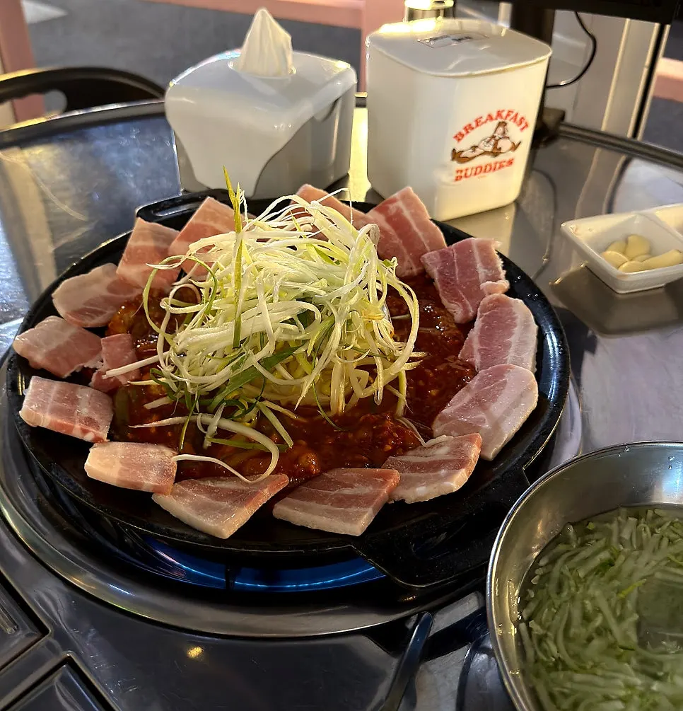 Finished jjukkumi-samgyeopsal with big octopus pieces and pork belly
