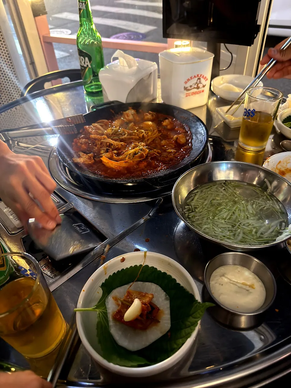 Perilla leaf wrap with jjukkumi, pork belly, and flying fish roe