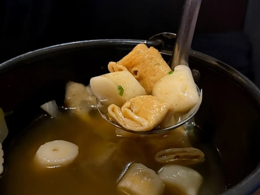 Fish cake soup enjoyed with skewers