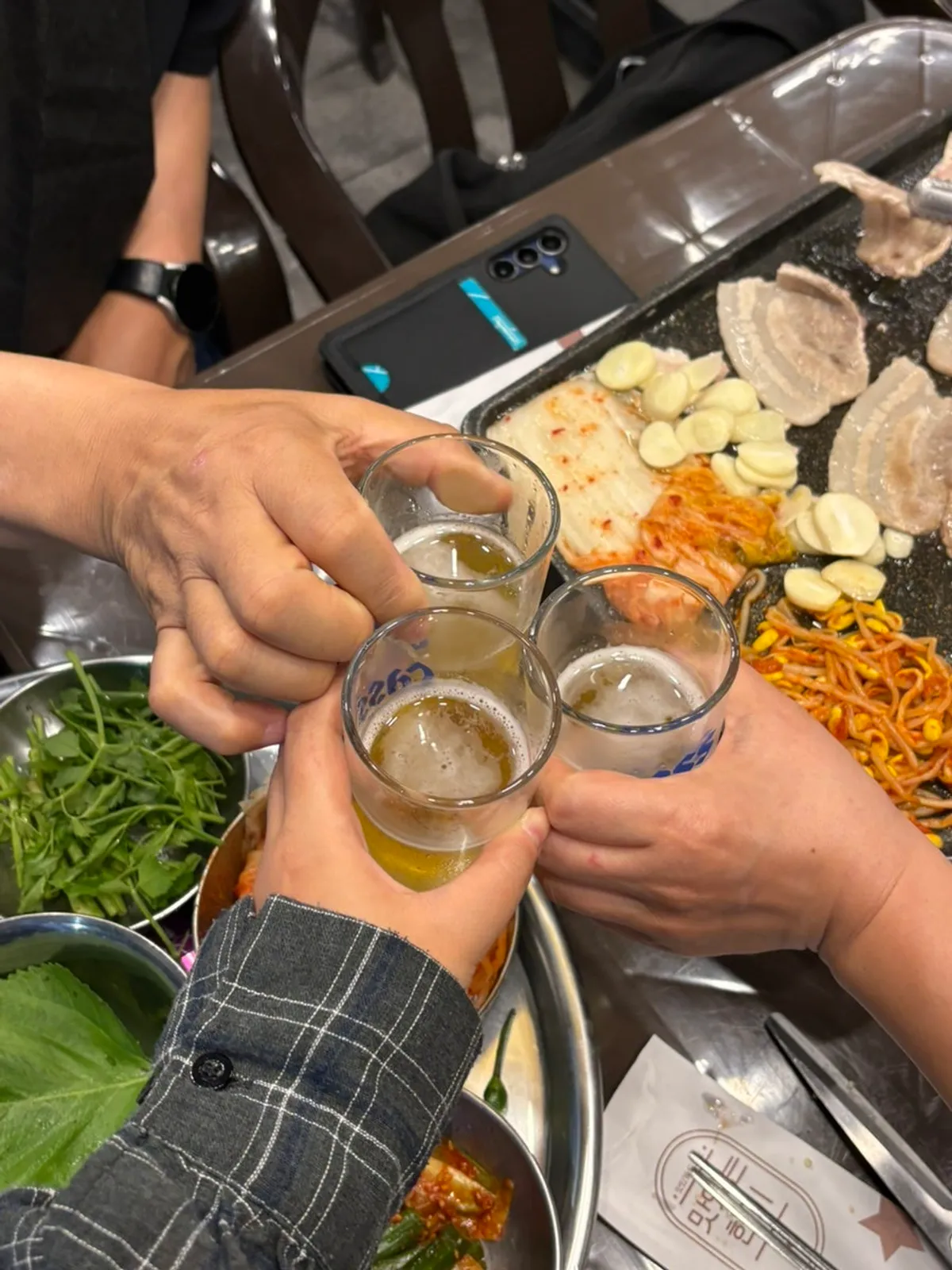 Outdoor table setup with the grill and doenjang jjigae