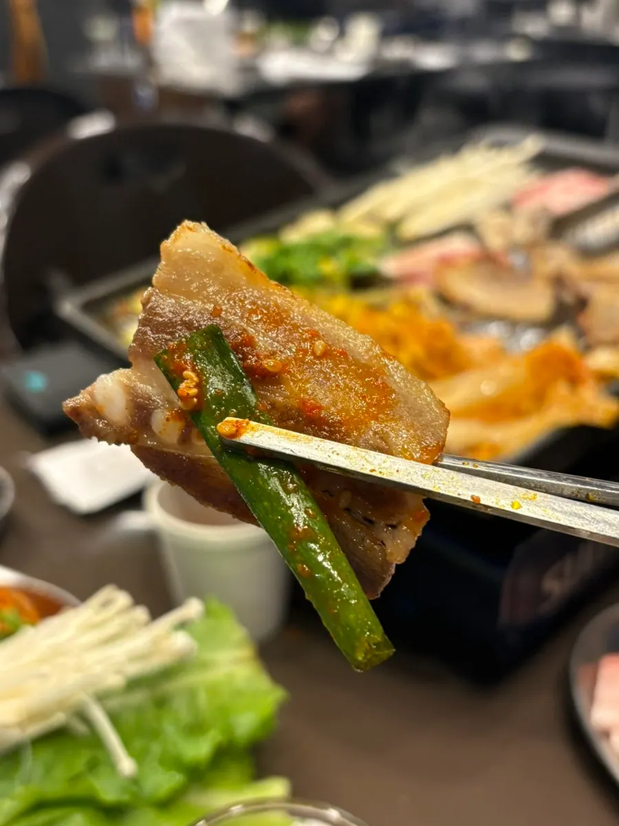 Minari and kimchi added to the grill