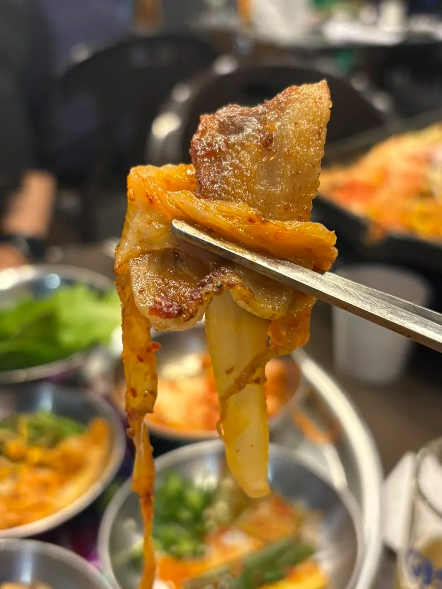 Pork belly picked up together with minari
