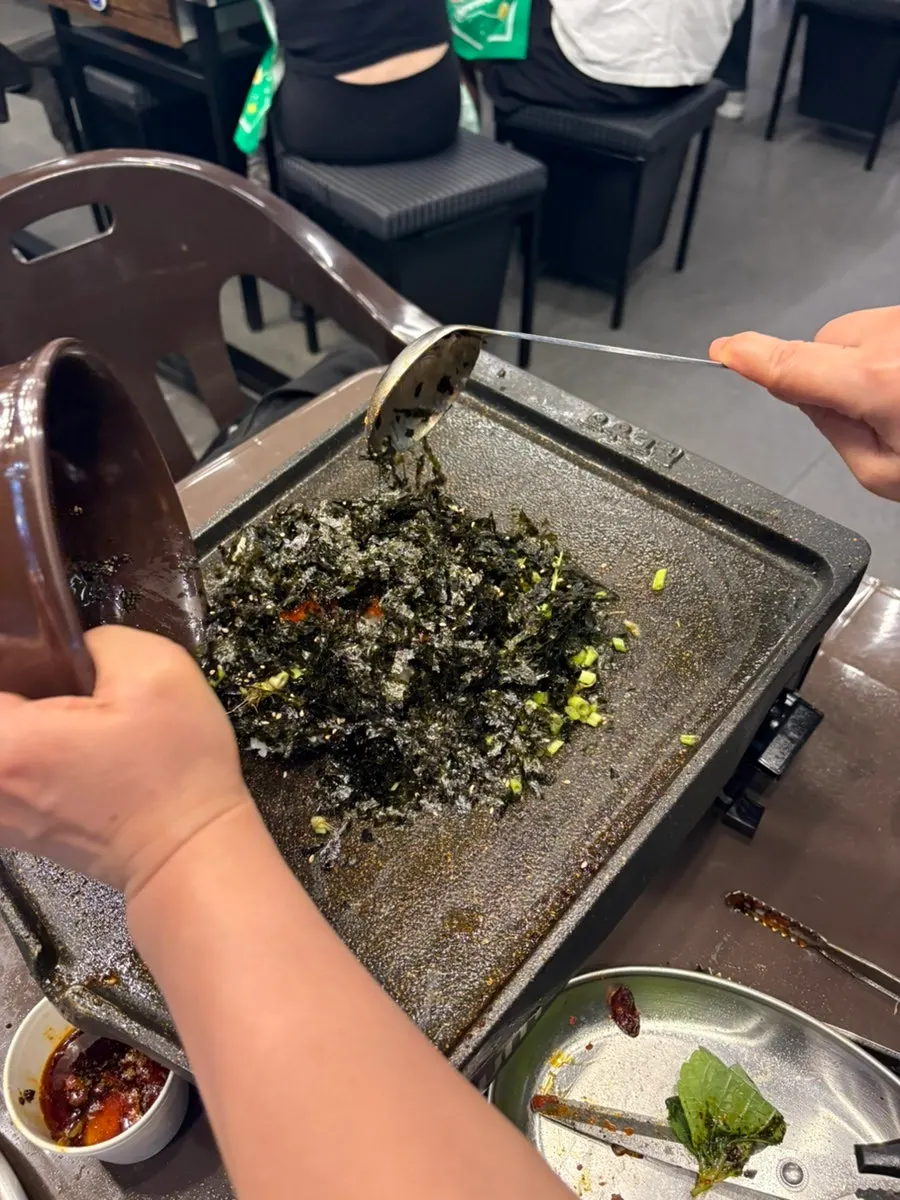Self-fried rice cooking on the grill