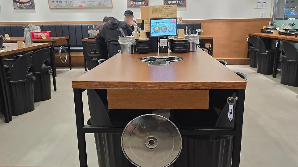 Restaurant seating with table induction burners