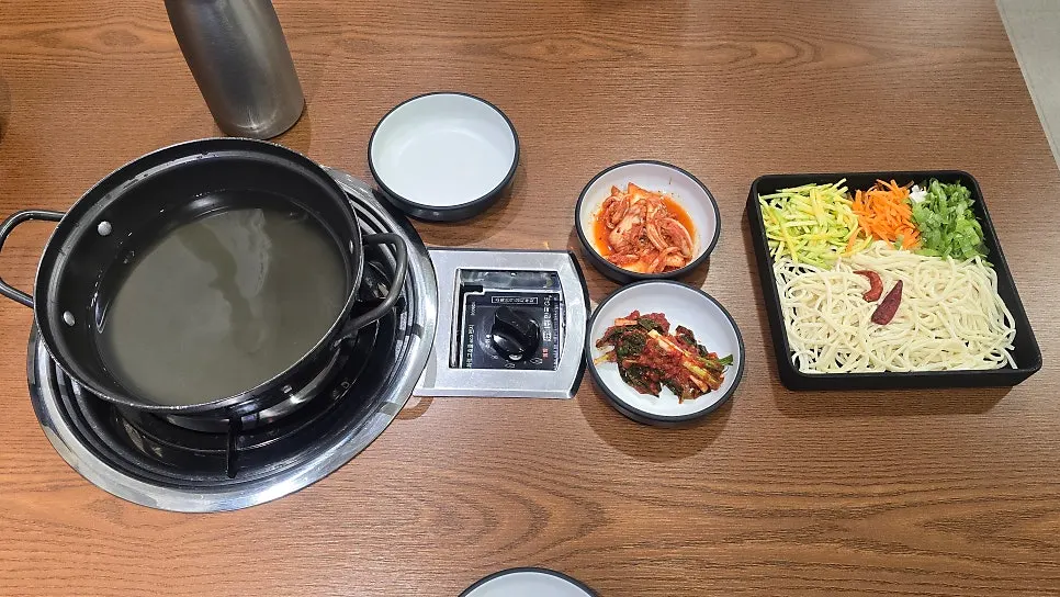Seafood broth pot on the table