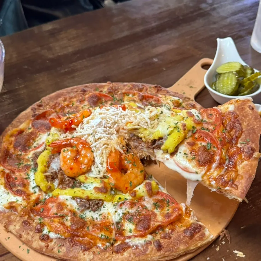 Pastry pizza topped with potatoes and shrimp