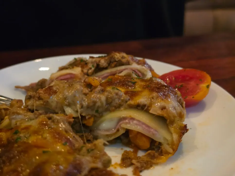 Cross-section of layered lasagna sheets and cheese