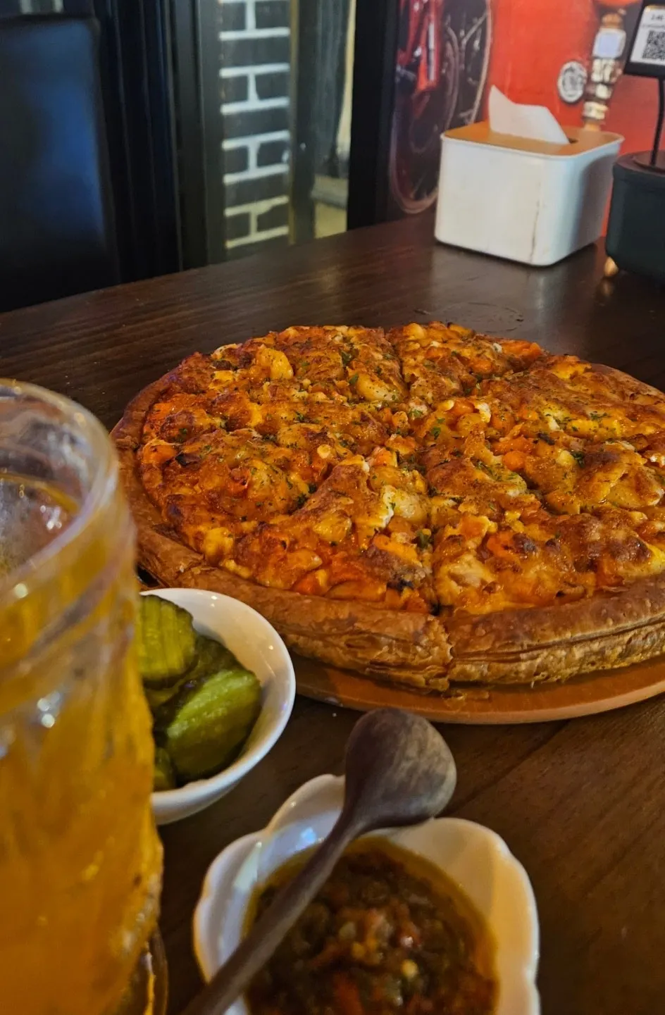 Enjoying shrimp pizza one slice at a time