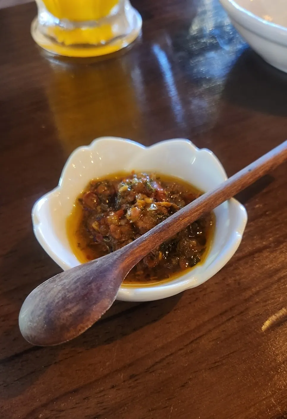 Spicy sauce and pickles served with pizza