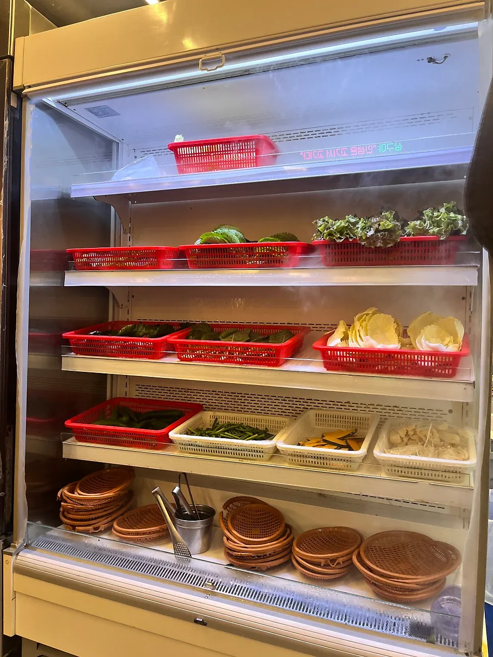 Self-serve vegetable bar next to the table