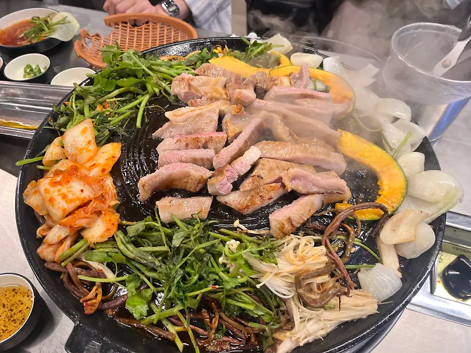 Specially seasoned dried radish greens cooking in pork fat