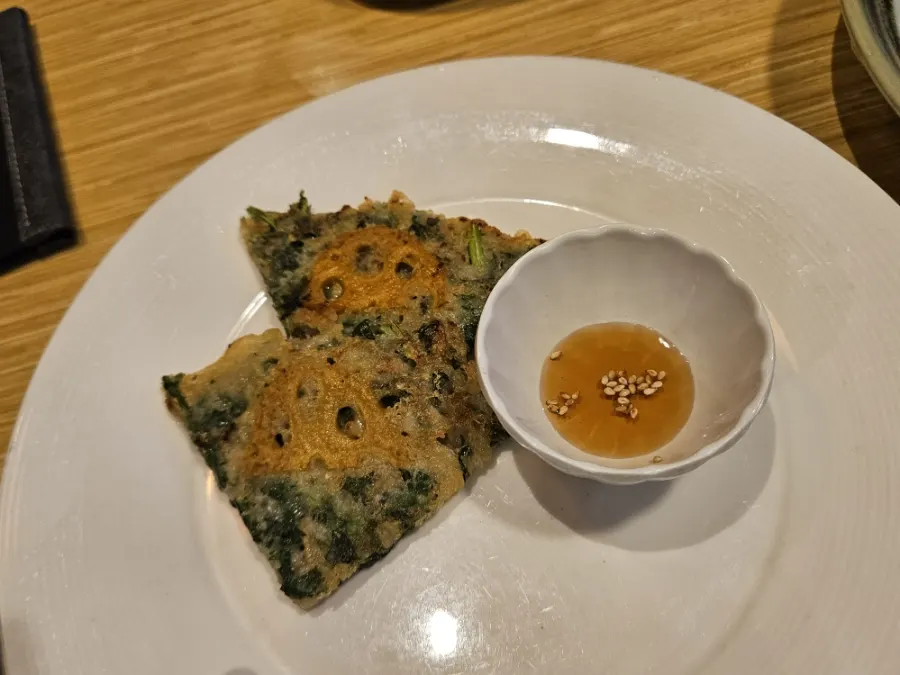 Assorted fritters drizzled with chili sauce