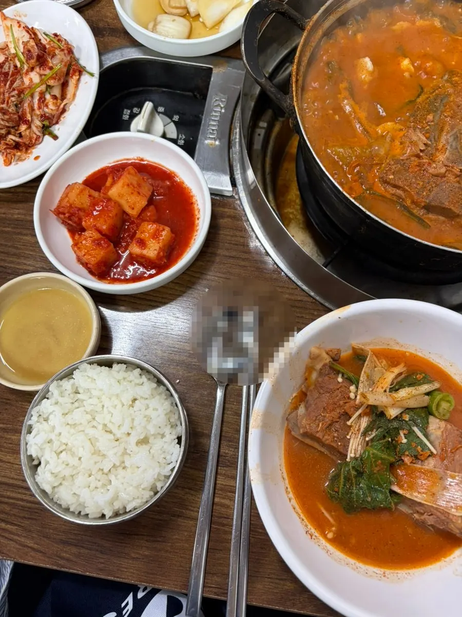 Gamjatang with hand-pulled dumplings added