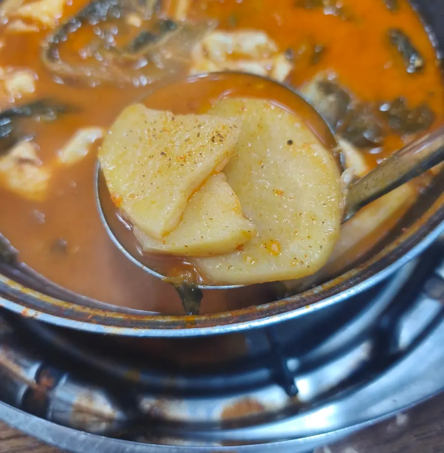 Gamjatang full of potatoes and other ingredients
