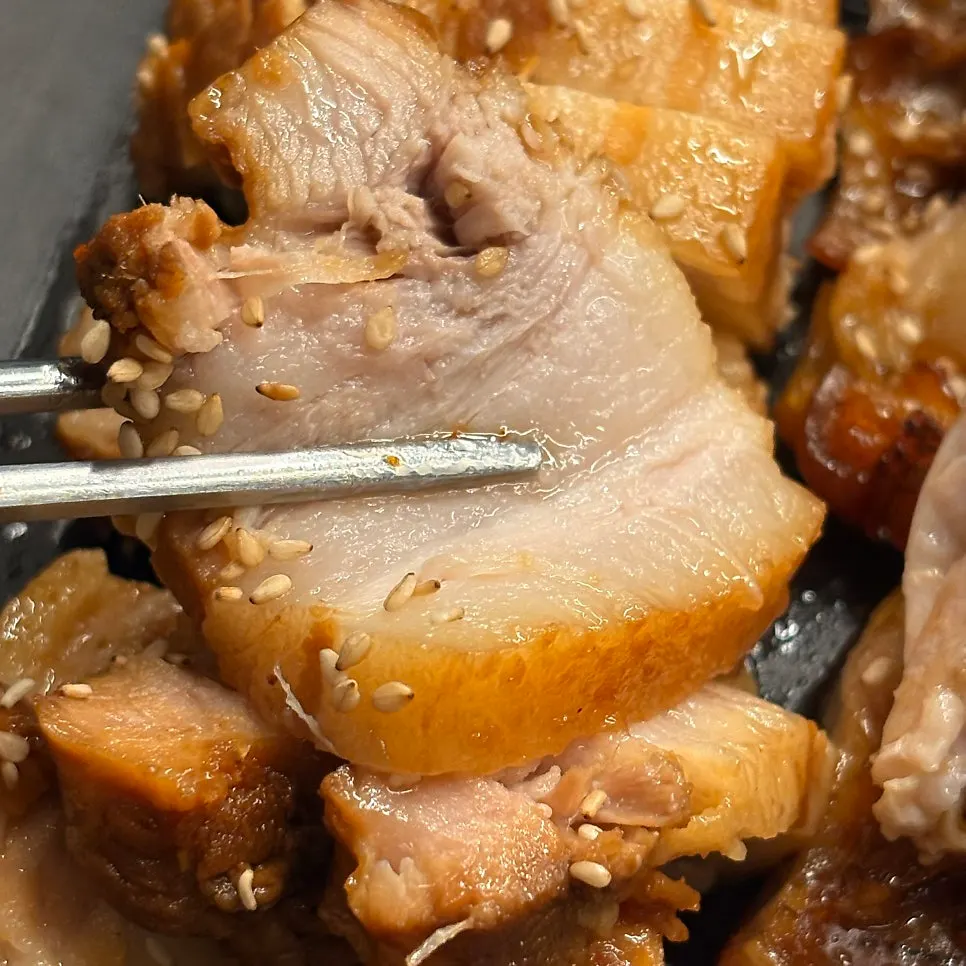 A bite of jokbal wrapped in lettuce