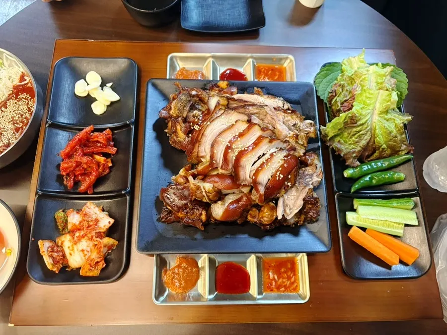 A piece of meat topped with pickled radish