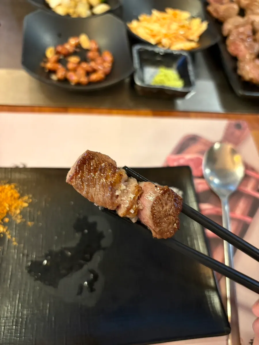 A side dish plate with chili peppers and wasabi